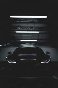 A high-performance car speeding on an open road, showcasing power, speed, and precision engineering.